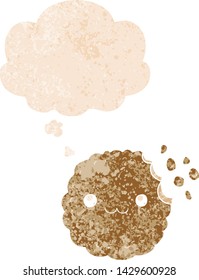 cartoon biscuit with thought bubble in grunge distressed retro textured style