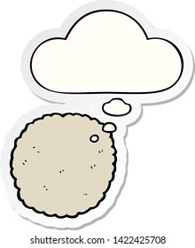 cartoon biscuit with thought bubble as a printed sticker