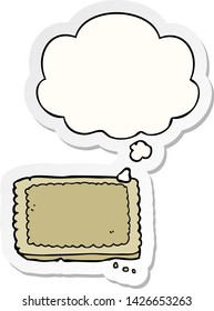 cartoon biscuit with thought bubble as a printed sticker