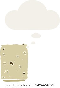 cartoon biscuit with thought bubble in retro style
