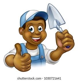 A cartoon black builder or bricklayer construction worker holding a masons brick laying trowel hand tool and giving a thumbs up