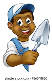 A cartoon black builder or bricklayer construction worker holding a masons brick laying trowel hand tool leaning around sign