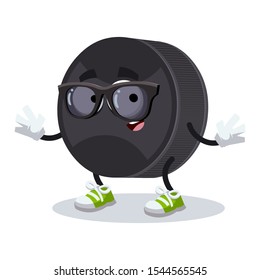 cartoon black rubber hockey puck character mascot in black sunglasses on a white background