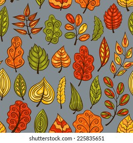 Cartoon blue hand-drawn seamless pattern with autumn leaves. Vector background.