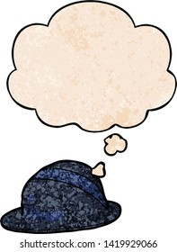 cartoon bowler hat with thought bubble in grunge texture style