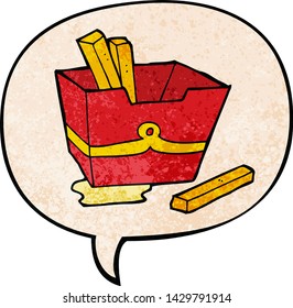 cartoon box of fries with speech bubble in retro texture style