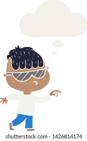 cartoon boy wearing sunglasses pointing with thought bubble in retro style
