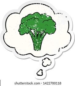 cartoon brocoli with thought bubble as a distressed worn sticker