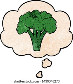 cartoon brocoli with thought bubble in grunge texture style