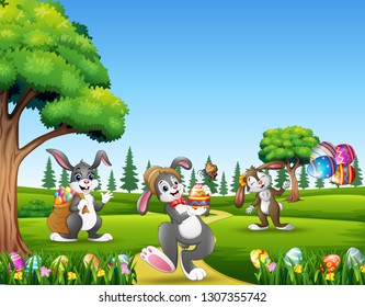 Cartoon bunnies holding decorated eggs on easter background