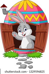 Cartoon bunny with decorated Easter eggs house