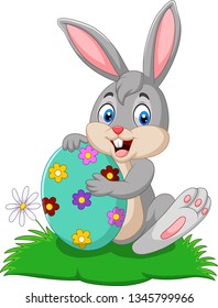 Cartoon bunny holding Easter egg 