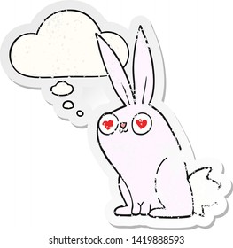 cartoon bunny rabbit in love with thought bubble as a distressed worn sticker