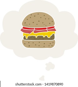 hamburguesa de dibujos animados con burbuja de pensamiento en estilo retro