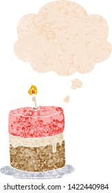 cartoon cake with thought bubble in grunge distressed retro textured style