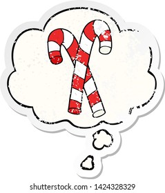 cartoon candy canes with thought bubble as a distressed worn sticker