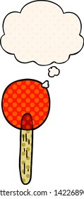 cartoon candy lollipop with thought bubble in comic book style