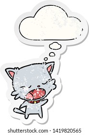 cartoon cat talking with thought bubble as a distressed worn sticker