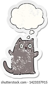 cartoon cat with thought bubble as a distressed worn sticker