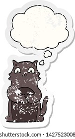 cartoon cat with thought bubble as a distressed worn sticker