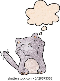 cartoon cat with thought bubble in grunge texture style