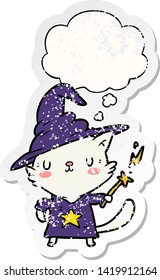 cartoon cat wizard with thought bubble as a distressed worn sticker