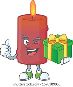 cartoon character of happy red candle with gift box