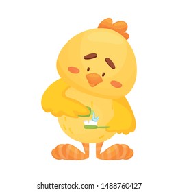 Cartoon chicken holds toothpaste and brush. Vector illustration on a white background.