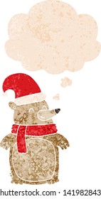 cartoon christmas bear with thought bubble in grunge distressed retro textured style