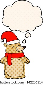 cartoon christmas bear with thought bubble in comic book style