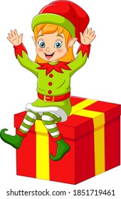 Cartoon christmas elf sitting on big gift box