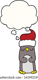 cartoon christmas penguin with thought bubble