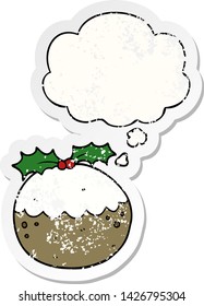 cartoon christmas pudding with thought bubble as a distressed worn sticker