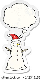 cartoon christmas snowman with thought bubble as a distressed worn sticker
