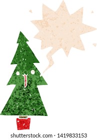 cartoon christmas tree with speech bubble in grunge distressed retro textured style