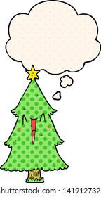 cartoon christmas tree with thought bubble in comic book style