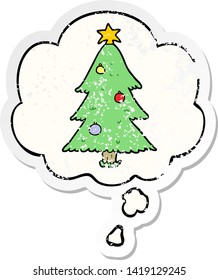 cartoon christmas tree with thought bubble as a distressed worn sticker