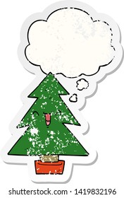 cartoon christmas tree with thought bubble as a distressed worn sticker