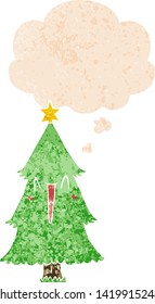 cartoon christmas tree with thought bubble in grunge distressed retro textured style