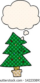 cartoon christmas tree with thought bubble in comic book style