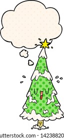 cartoon christmas tree with thought bubble in comic book style