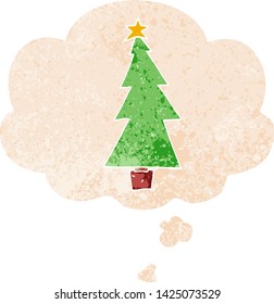 cartoon christmas tree with thought bubble in grunge distressed retro textured style