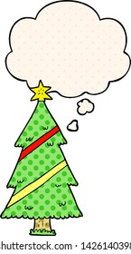 cartoon christmas tree with thought bubble in comic book style