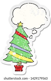 cartoon christmas tree with thought bubble as a distressed worn sticker