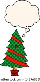 cartoon christmas tree with thought bubble in comic book style