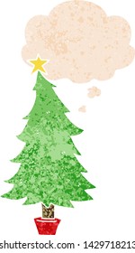 árbol de navidad de dibujos animados con burbuja de pensamiento en un estilo retro angustiado y con textura estrafalaria