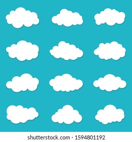 Cartoon cloud of sky on blue background. Graphic heaven in flat style. Set of overcast cloudy. Set icons of cloud bubble shape. Creative white clouds form for message. Isolated vector illustration