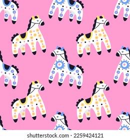 Cartoon colorful horses pattern on a pink background. 
