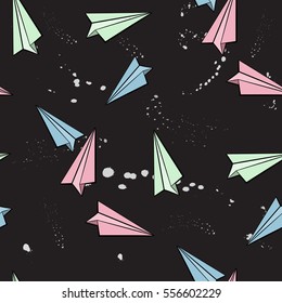 Cartoon colorful paper plan on black background. Seamless pattern.