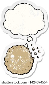 cartoon cookie with thought bubble as a distressed worn sticker